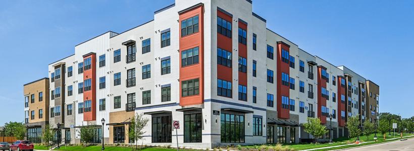 A four story square building comprised of one and two-bedroom apartments.